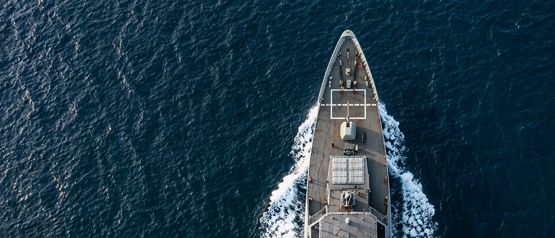Aerial view of a naval ship in the ocean