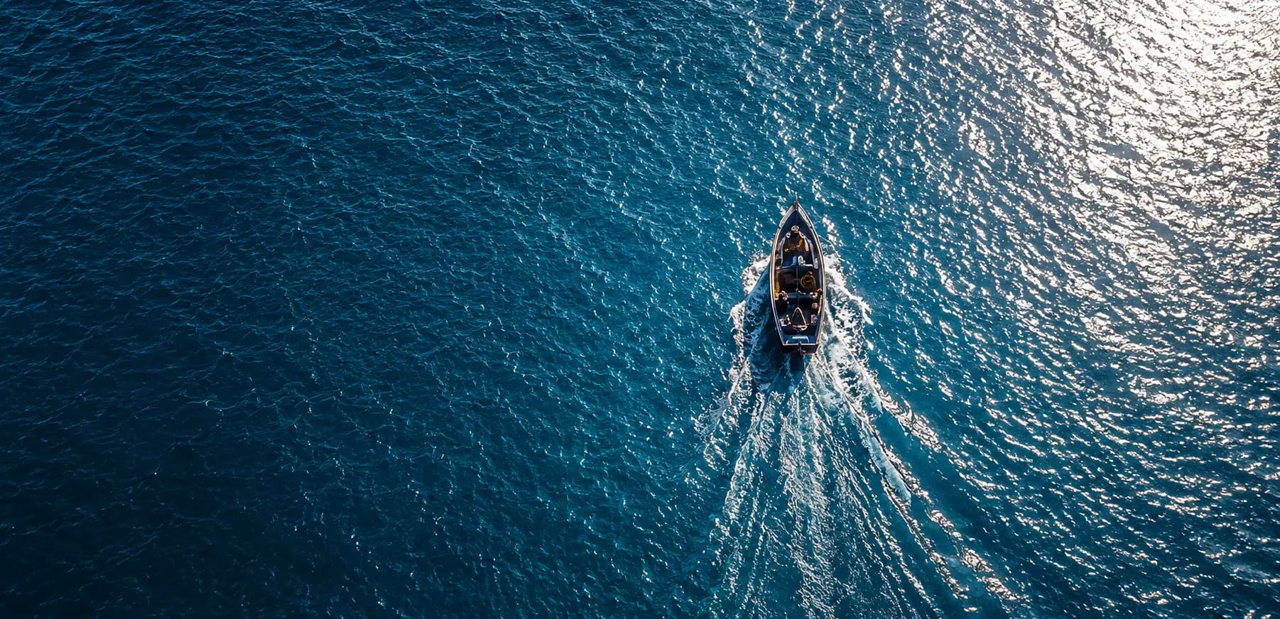 Boat making a splash turn in the ocean